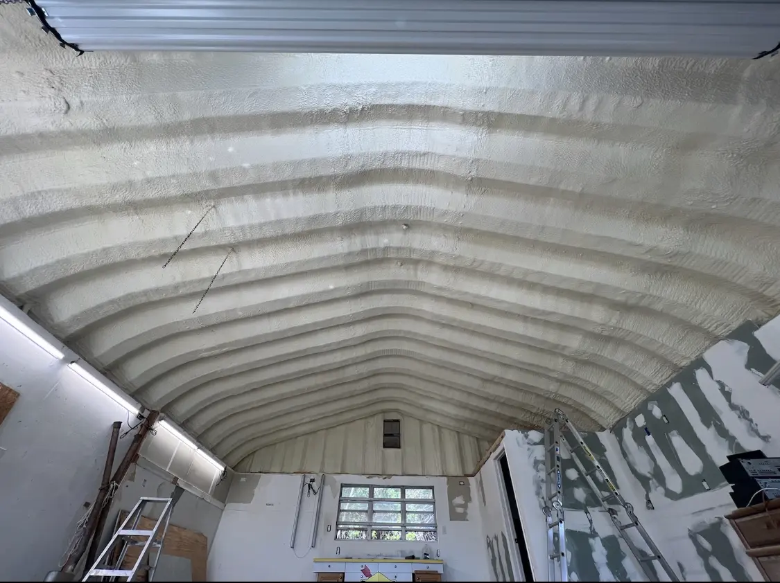 Spray polyurethane foam applied to the underside of a metal roof deck in Fort Wayne